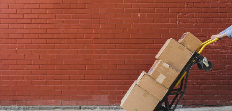 shipping-boxes-in-front-of-red-brick_4460x4460